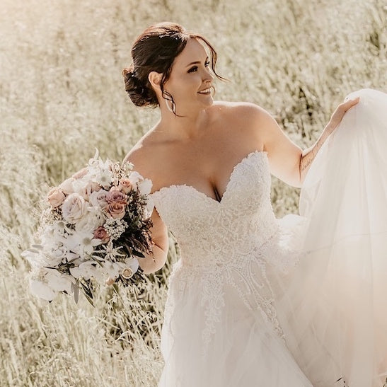mudgee bride and her bouquet by Mudgee monkey wedding florist amongst the vines