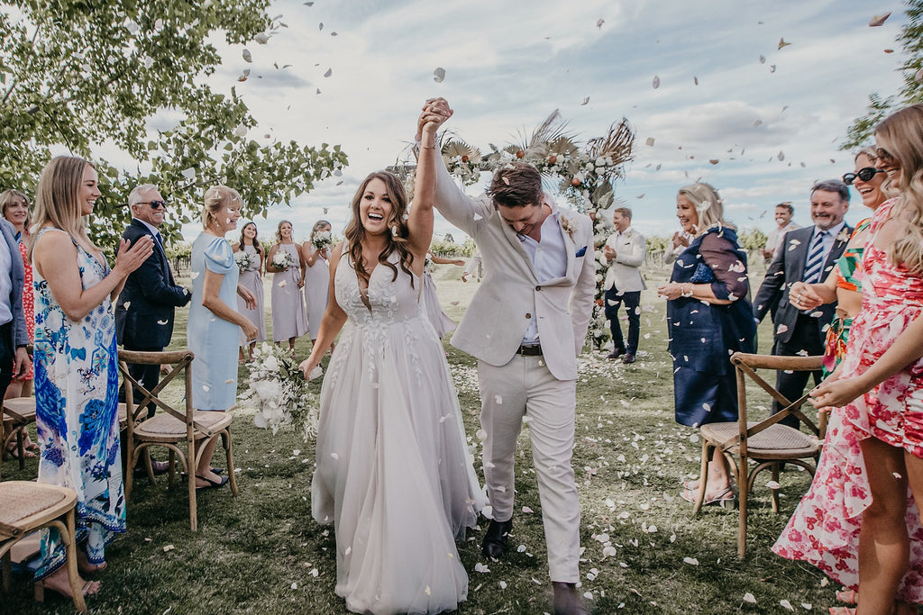 Amazing wedding arbour by Mudgee monkey florist at The vine grove mudgee. Mudgee wedding venue. happy couple at their wedding in mudgee 2850 mid west NSWt,