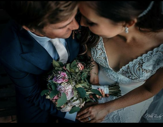 intimate wedding moment in mudgee with a stuning rose and protea bouquet by mudgee monkey florist