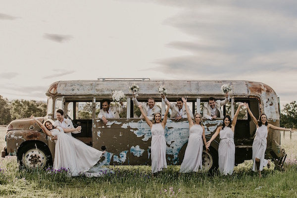 Wedding party at the vinegrove mudgee playing on the old bus with flowers by Mudgee Monkey wedding and event stylist mudgee